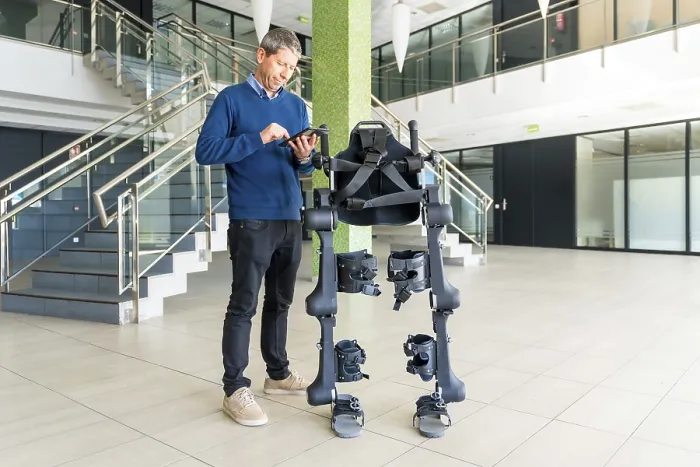 Framed Print : Mechanical Exoskeleton Engineer with Tablet Print Framed Print : Mechanical Exoskeleton Engineer with Tablet Print