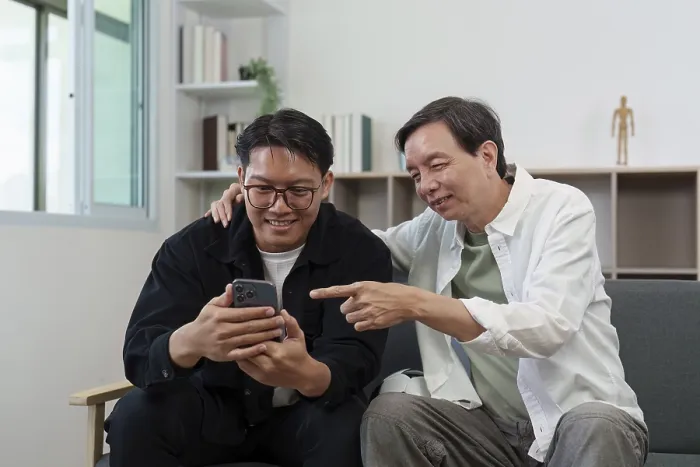 Framed Print : Two Men Engage with a Smartphone Print Framed Print : Two Men Engage with a Smartphone Print