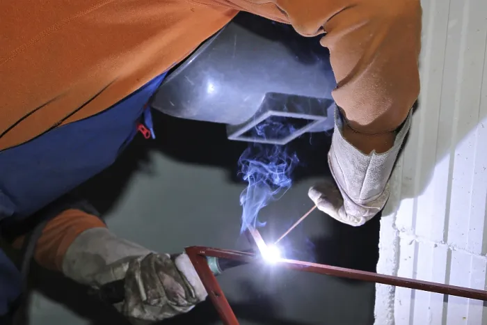 Framed Print : Metal Worker During Welding Work Print