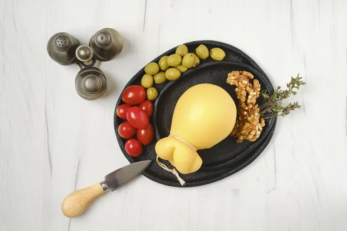 Framed Print : Overhead view of pulled scamorza cheese on a plate Print Framed Print : Overhead view of pulled scamorza cheese on a plate Print