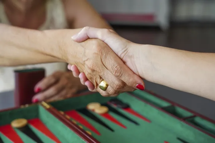 Framed Print : Two People Shaking Hands Over a Backgammon Board Print Framed Print : Two People Shaking Hands Over a Backgammon Board Print