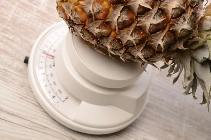 Framed Print : Pineapple on a Scale Print by imageBROKER Framed Print : Pineapple on a Scale Print by imageBROKER