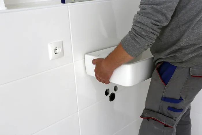 Framed Print : Plumber Installs New Washbasin Print Framed Print : Plumber Installs New Washbasin Print