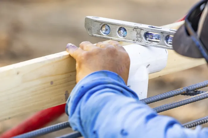 Framed Print : Plumber using level to install PVC pipe Print Framed Print : Plumber using level to install PVC pipe Print
