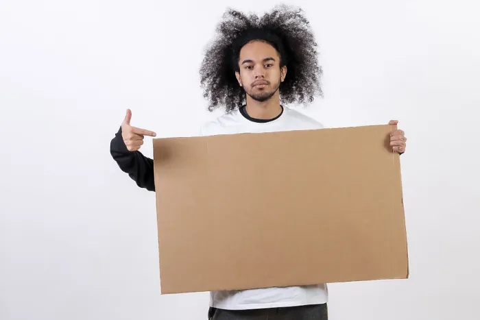 Framed Print : Young Man Pointing to Sign Print Framed Print : Young Man Pointing to Sign Print
