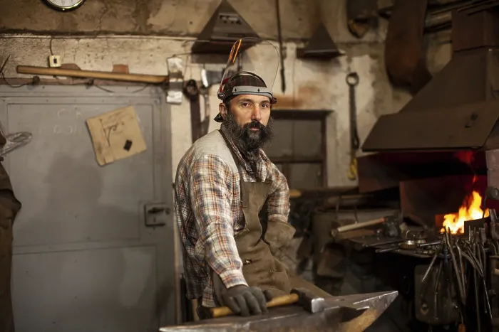 Framed Print : The Blacksmith Print: A Master Craftsman at Work