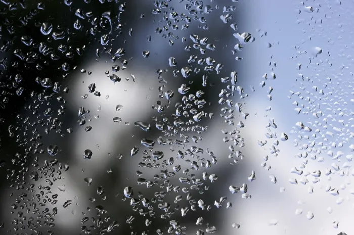 Framed Print : Rain Drops on Window as the Clouds Clear Behind - Print