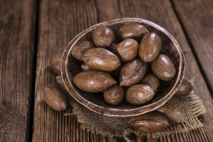 Framed Print : Rustic Wooden Table with Pecan Nuts Print Framed Print : Rustic Wooden Table with Pecan Nuts Print