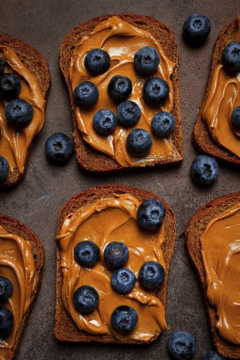 Framed Print : Rye bread with peanut paste and blueberries Print, top view Framed Print : Rye bread with peanut paste and blueberries Print, top view
