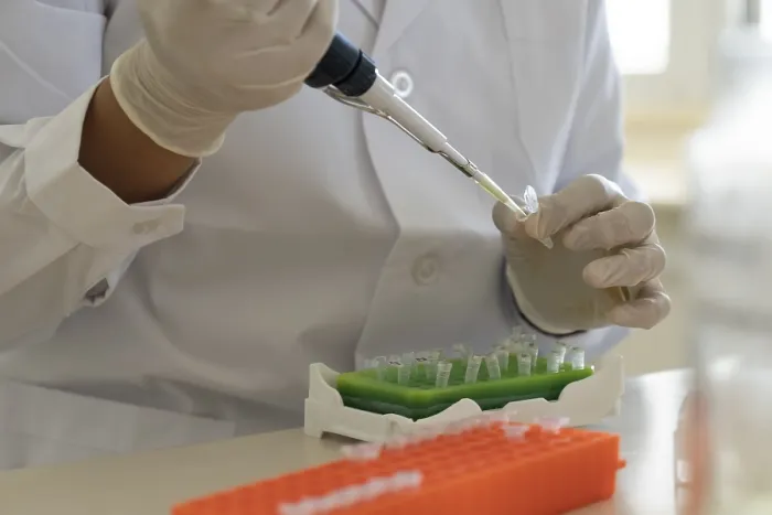Framed Print : Scientist Using Micropipette Print Framed Print : Scientist Using Micropipette Print