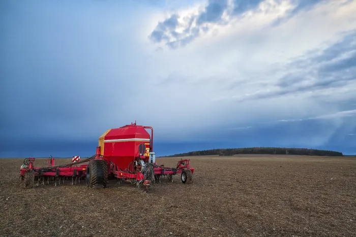 Framed Print : Seeding Machine on Empty Field Before Storm Print Framed Print : Seeding Machine on Empty Field Before Storm Print