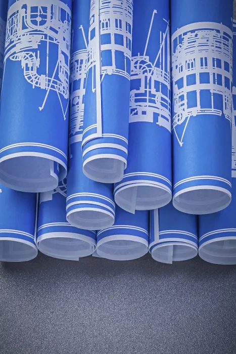 Framed Print : Blue Rolled Engineering Drawings Print on Grey Background
