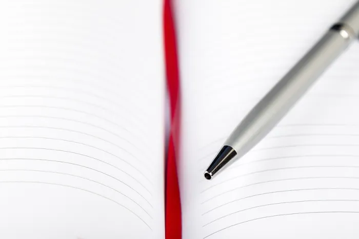 Framed Print : Silver Pen on Opened Notebook Print with Red String