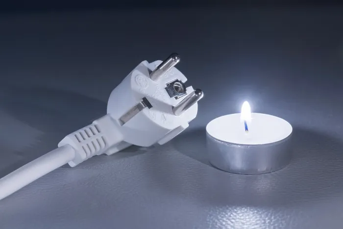 Framed Print : A Single Candle Next to an Electrical Plug Print Framed Print : A Single Candle Next to an Electrical Plug Print
