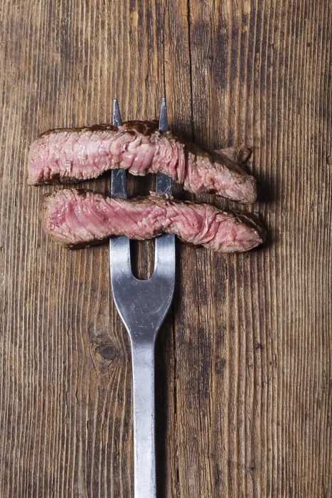 Framed Print : Slice a Steak onto a Meat Fork Print
