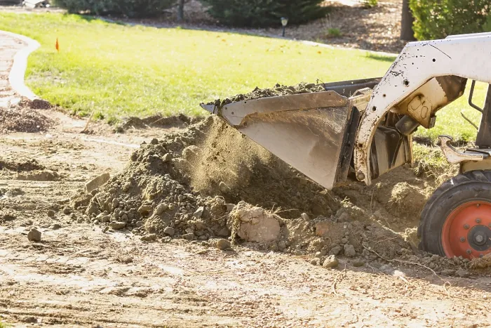Framed Print : Small Bulldozer Digging in Yard for Pool Installation Print