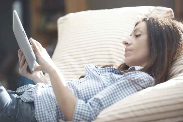 Framed Print : Indoor Portrait Print of Woman Using Tablet Computer