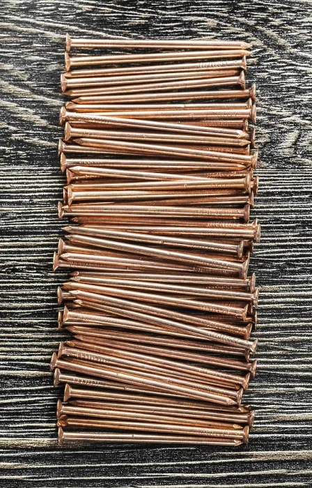 Framed Print : Stack of Copper Nails Print on Wooden Board Framed Print : Stack of Copper Nails Print on Wooden Board