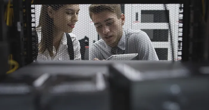 Framed Print : Technicians analyzing server in server room Print Framed Print : Technicians analyzing server in server room Print