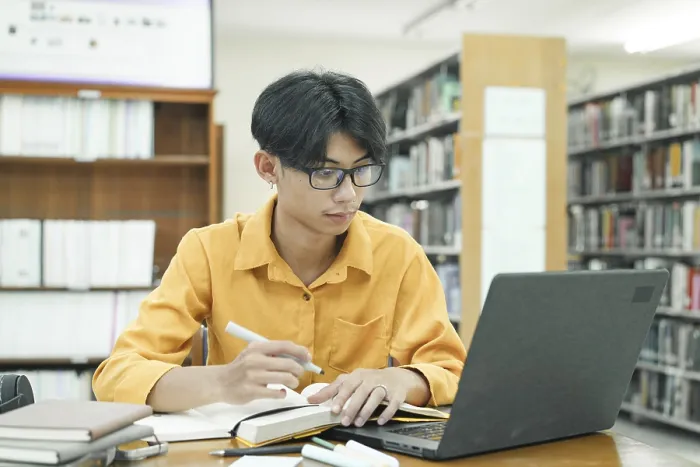 Framed Print : Print of a Young Student Preparing for Class Framed Print : Print of a Young Student Preparing for Class