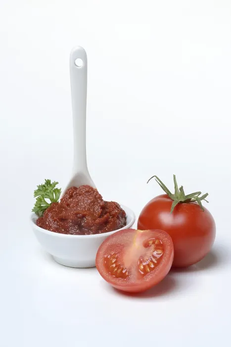 Framed Print : Tomato paste with spoon in bowl print, Germany