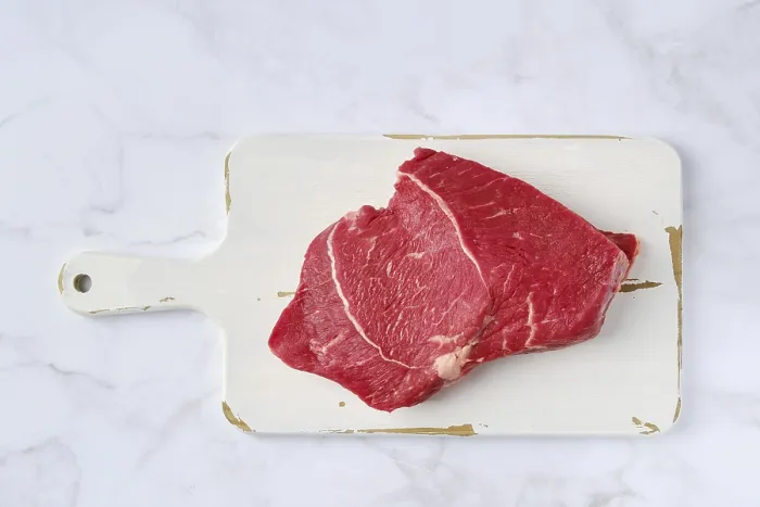 Framed Print : Raw Top Side Beef Steak Print on Marble Background Framed Print : Raw Top Side Beef Steak Print on Marble Background