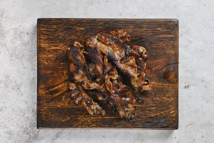 Framed Print : Top View of Serving Board with Fried Beef Bacon Strips Print Framed Print : Top View of Serving Board with Fried Beef Bacon Strips Print