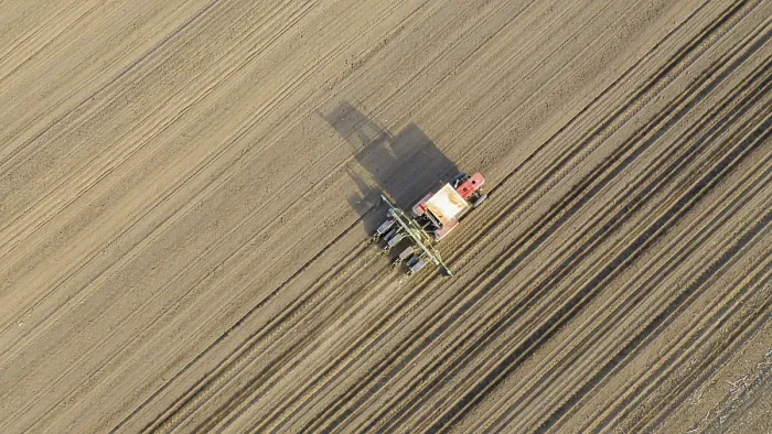 Framed Print : Above View Print of Tractor Pulling Seeder Over Arable Field Framed Print : Above View Print of Tractor Pulling Seeder Over Arable Field