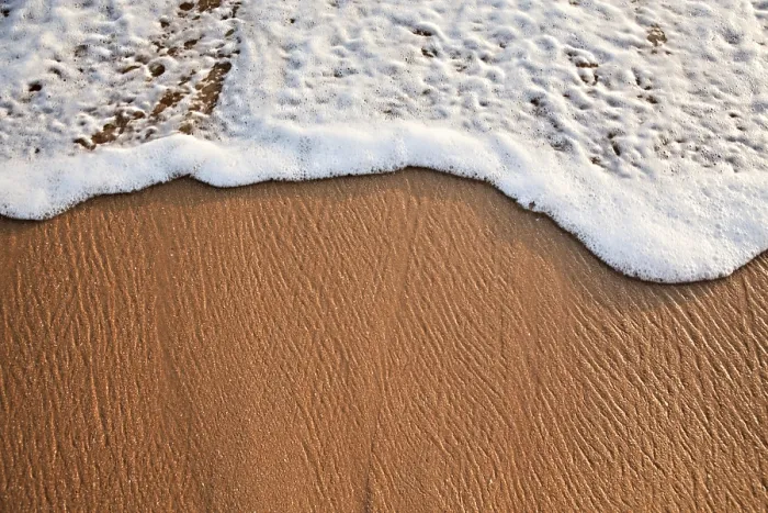 Framed Print : Wave Surging on Sand Print