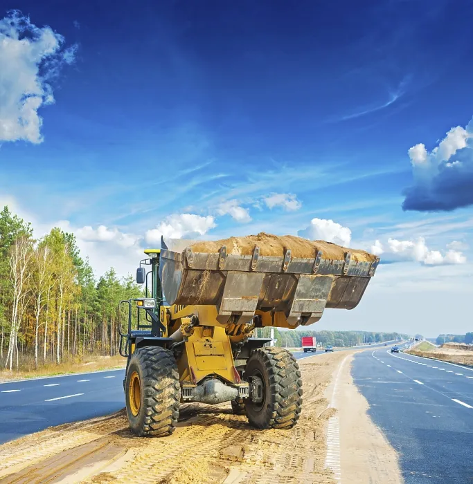 Framed Print : Wheelloader with scoop full of sand construction concept Framed Print : Wheelloader with scoop full of sand construction concept