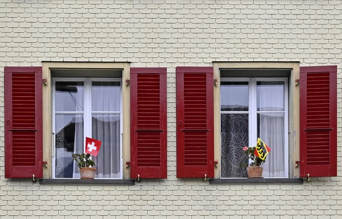 Framed Print : Window with Swiss and Bernese Flags Print
