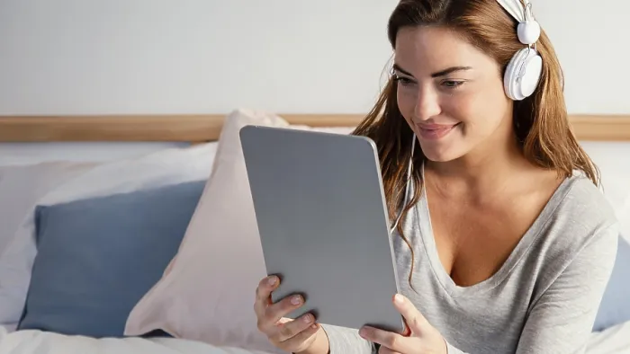 Framed Print : Woman with Headphones Using Tablet Print Framed Print : Woman with Headphones Using Tablet Print