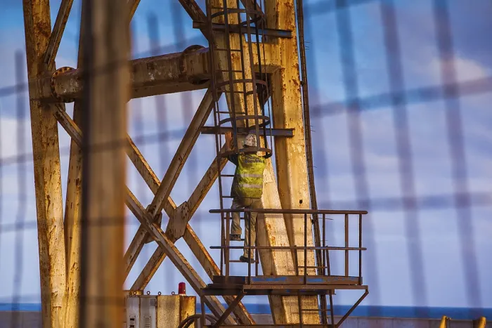 Framed Print : Worker Climbing on a Crane Print Framed Print : Worker Climbing on a Crane Print