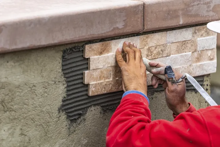 Framed Print : Worker Installing Wall Tile Print at Construction Site Framed Print : Worker Installing Wall Tile Print at Construction Site