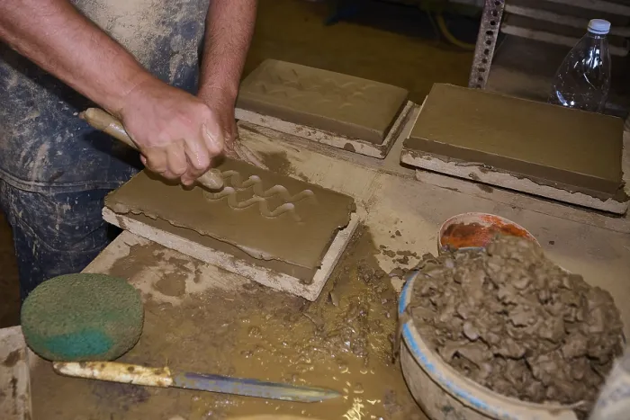 Framed Print : Worker's Hand Carving Patterns in Clay Bricks Print Framed Print : Worker's Hand Carving Patterns in Clay Bricks Print
