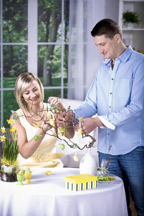 Framed Print : Young Couple Decorating for Easter Print Framed Print : Young Couple Decorating for Easter Print