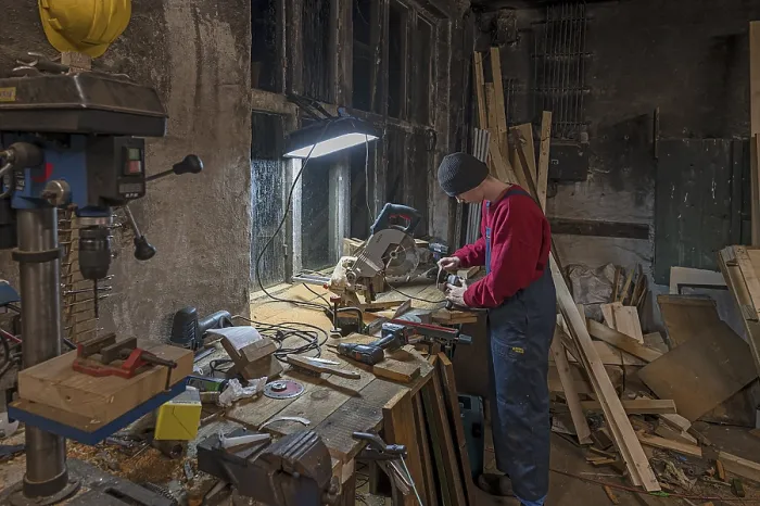 Framed Print : Young Man at a Flex in his Workshop Print, Germany Framed Print : Young Man at a Flex in his Workshop Print, Germany