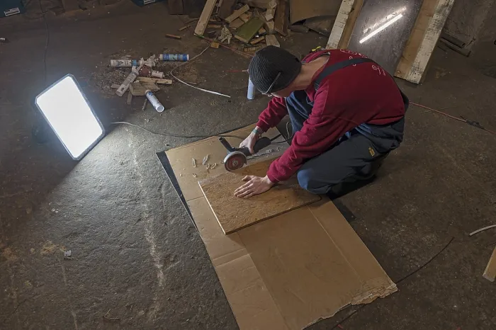 Framed Print : Young Man Working with an Angle Grinder Print, Germany Framed Print : Young Man Working with an Angle Grinder Print, Germany