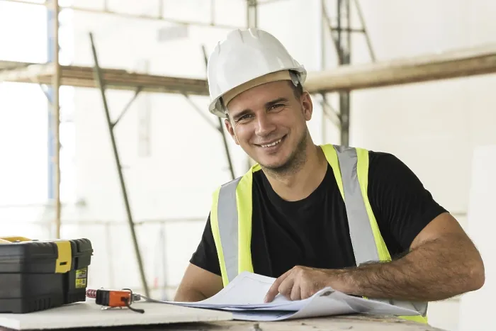 Framed Print : Construction Worker Checking Blueprints Print