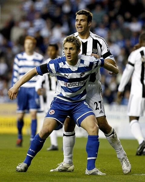 Kevin Doyle holds off the attentions of Steven Taylor
