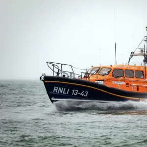 Clifden Shannon class lifeboat St Christopher 13-43 at sea during trials in Poole Bay. Shot from Shell Bay beach, Studland