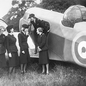 Air Transport Auxiliary pilots alongside an Airspeed Oxford