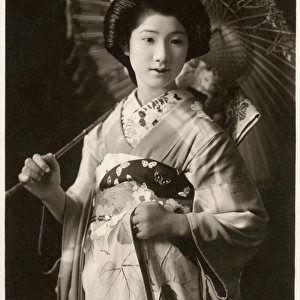 Beautiful Japanese Geisha Girl with parasol