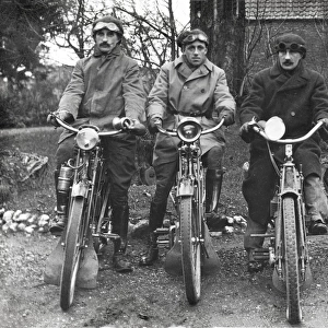 Three bikers on veteran motorcycles