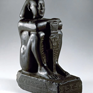 Block statue of Harsomtusemhat (664-610 B. C. ). Basalt. Lower