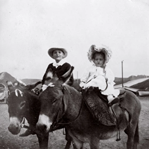Boy and girl on donkeys, Saltburn, North Yorkshire
