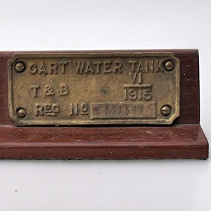 Brass plate, on a wooden plinth- CART WATER TANK