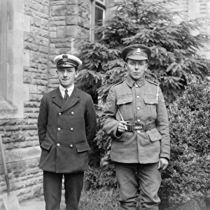 Two brothers in uniform, prepared for war