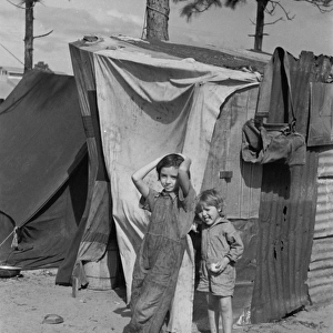 Two children of a migrant fruit worker from Tennessee