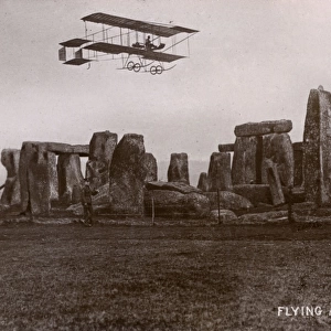 An early aircraft flying over Stonehenge, Wiltshire